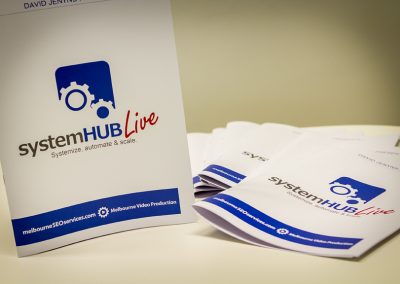SystemHUB Live event booklets by David Jenyns with gear logo and tagline Systemize, automate and scale