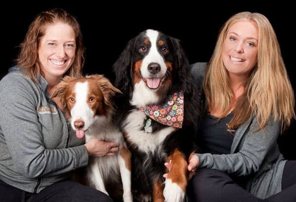 Jeanette and Nicole Farren, founders of DiggiddyDoggyDaycare, with two of their dogs